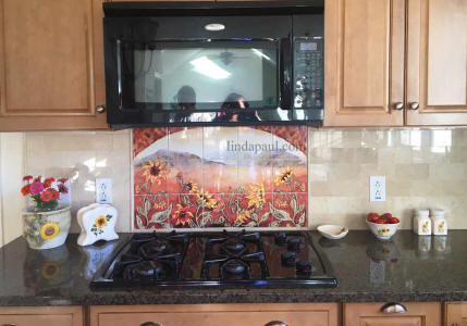 tile mural between stove and microwave