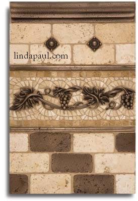 back splash tile design with metal tiles and accents