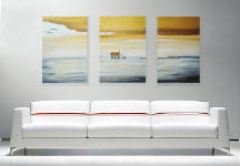 contemporary paintings over white sofa