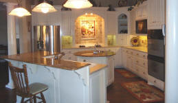 white cabinets round island