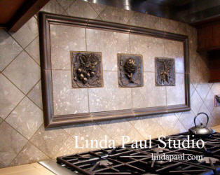 vegetable metal tile backsplash with radishes, artichoke and bunch of carrots tiles