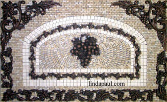 grapes mosaic and metal backsplash medlalion