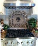 arched fleur de lis kitchen backsplash idea