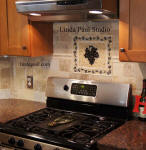 grape vine mosaic above stove