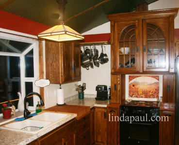 country kitchen with sunflower backsplash