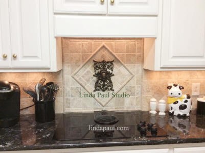 regency Lion onlay installed over stove on tumbled marble kitchen tile