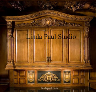 regal fleur plaque in custom carved cabinet