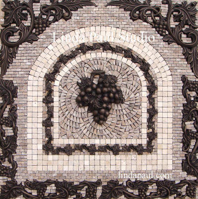 grapes stone and metal medallion